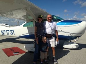 Tiberius, mom Joell and pilot Sam Samaha